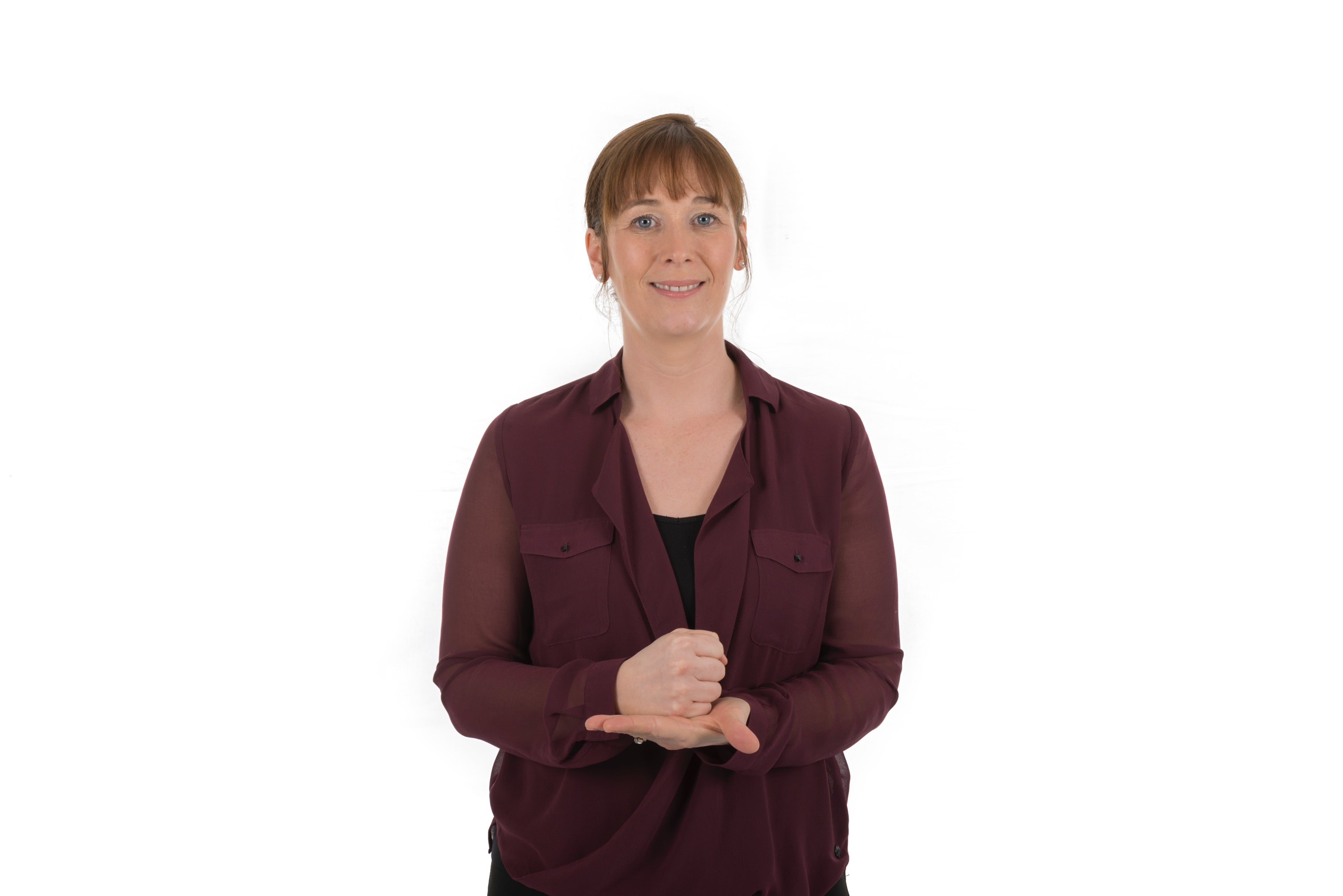 Woman Signing Lámh for "Help" wearing a maroon shirt on a white background