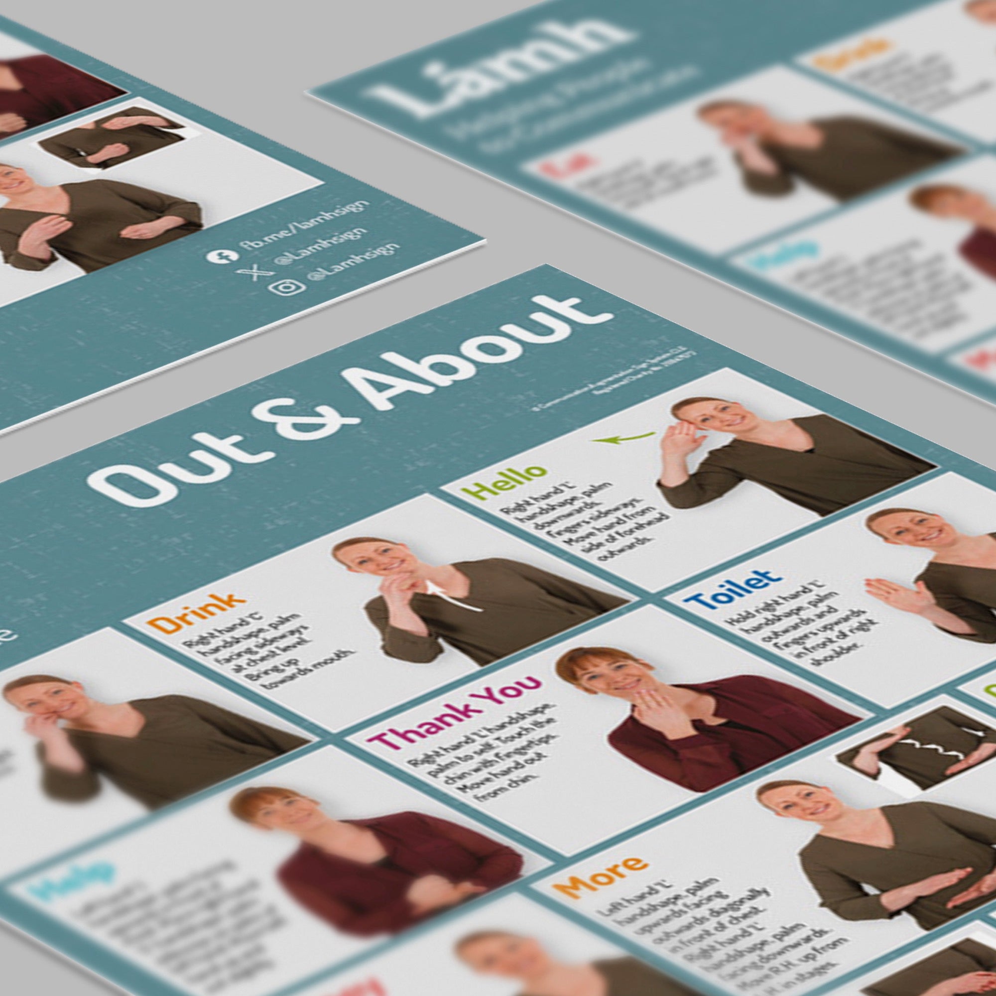 Educational posters with text and images of people on a gray surface